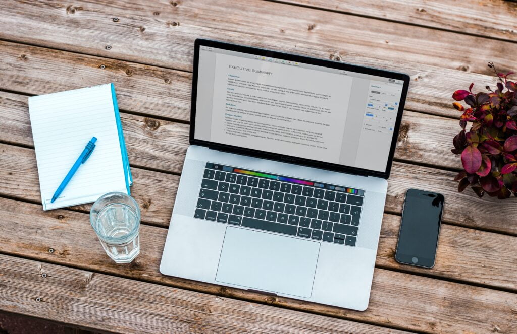 Laptop showing the building of a résumé website