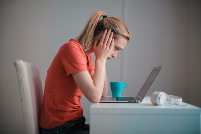Young woman deep in thought about career transition