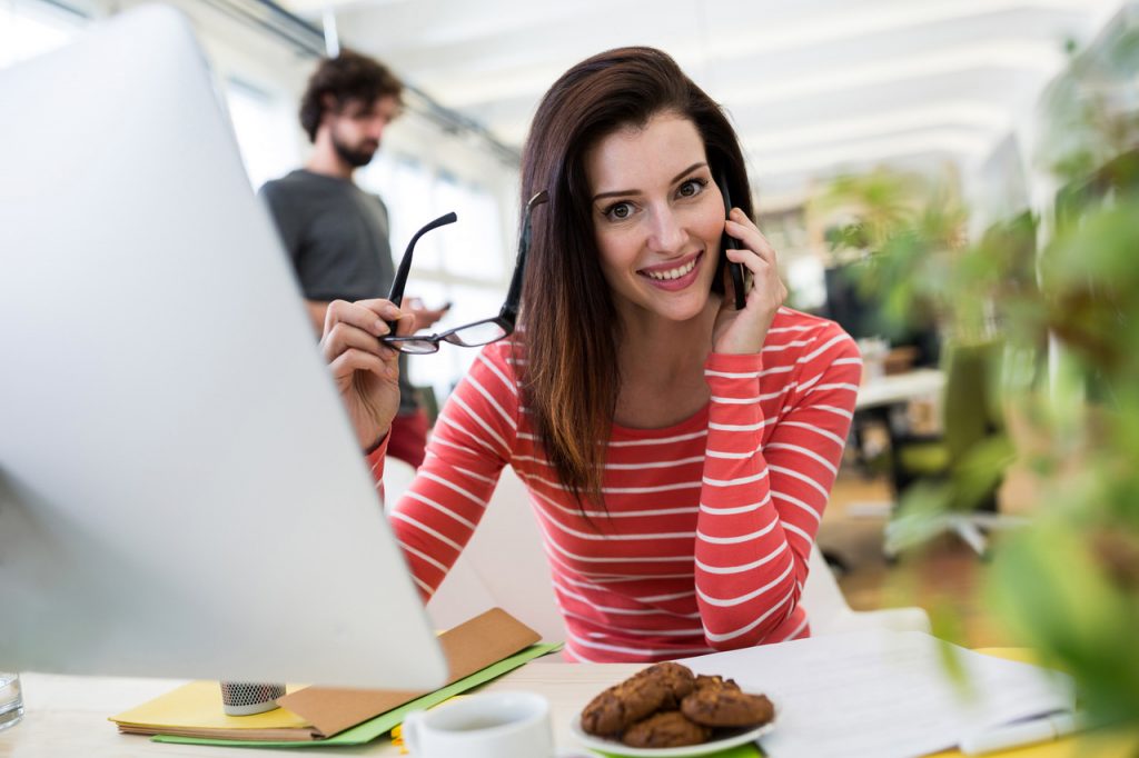 Young woman on phone following up on a job application